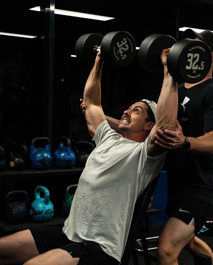 Athlete using massage gun for muscle recovery